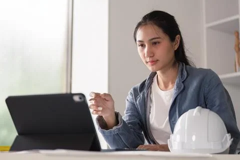 Engineer using tablet for project management in office Stock Photos