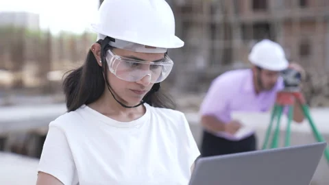 Engineer using technology devices to check plan details on construction site. Stock Footage 161808636