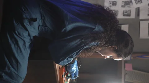 Engineer using a test head connected to the multimeter while examining a circuit Stock Footage 236190073