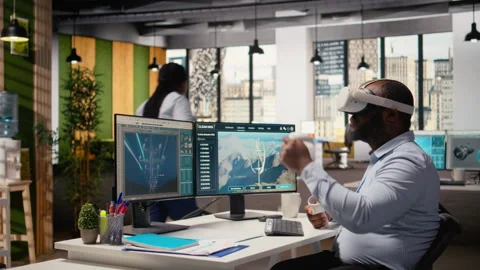 Engineer using virtual reality simulation to do clean energy technology testing Stock Footage 316007016