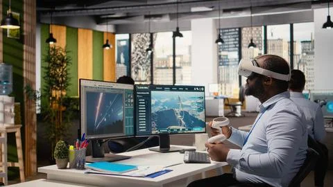 Engineer using virtual reality simulation to do clean energy technology testing 스톡 사진