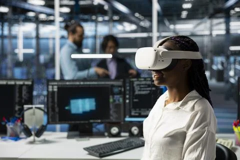 Engineer using virtual reality tech in data center to upgrade servers Stock Photos