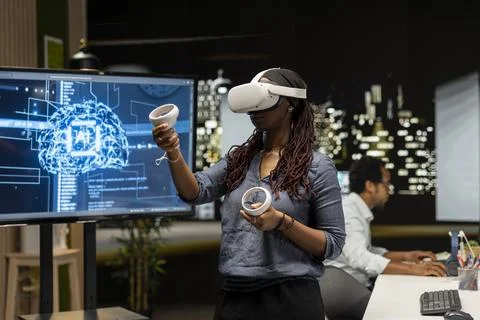 Engineer using virtual reality technology to develop deep learning APIs Stock Photos