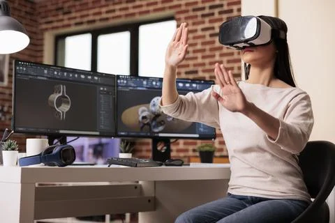 Engineer using vr glasses to manufacture gears Stock Photos