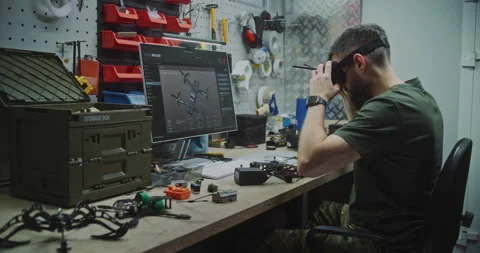 Engineer Using VR Goggles to Virtually Design Stock Footage 322106184
