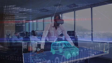 Engineer using VR launching 3D car model code overlays as colleague checking Stock Footage 311900804