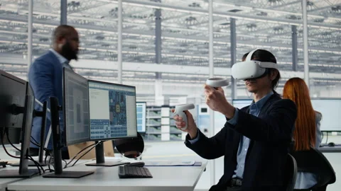 Engineer using VR technology to optimize microchip production in factory Stock Footage 335880175