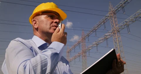 Engineer Using Walkie Talkie Indicate Plans Parameters High Energy Installation Stock-Footage 50037438