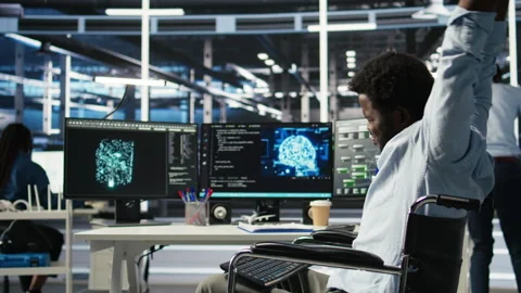 Engineer using wheelchair in data center using AI node tree software Stock Footage 307037083