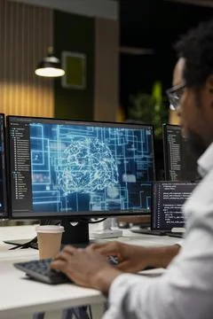 Engineer utilizing AI on computer to optimize performance Foto stock
