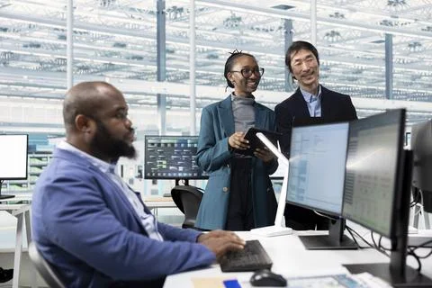 Engineer verifying PCB factory microelectronics functionality and reliability Stock Photos