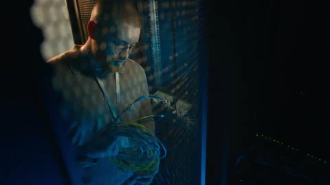 Engineer Verifying Wires Functioning Properly in Supercomputing Room Video stock 311306890
