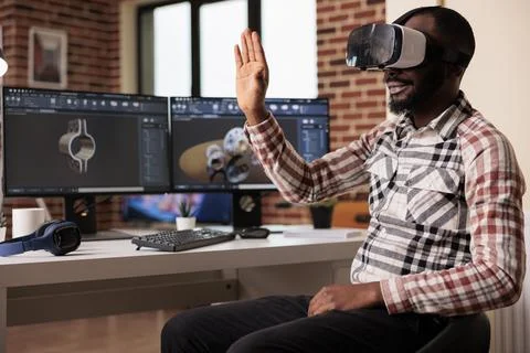 Engineer with vr goggles developing industrial product Stock Photos