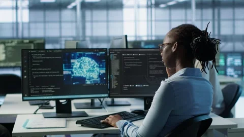 Engineer waiting at PC desk for checkup to be done on server room Stock Footage 319243542