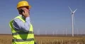 Engineer Walk and Talk to Mobile Technical Issues Wind Turbines Generators 4k or 4k+ Resolution