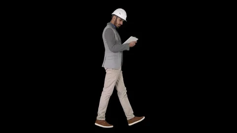 Engineer walking and working on digital tablet, Alpha Channel Stock-Footage 117363513