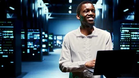 Engineer walking between supercomputers 스톡 사진