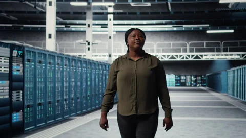 Engineer walking in data center, checking hardware for system stability Stock Footage 317206274