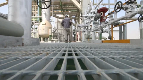 Engineer walking in refinery plant Stock Footage 34358395