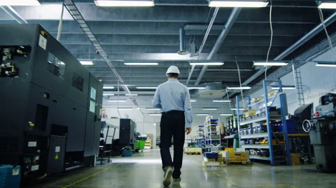 Engineer is Walking Through Factory. Back View Stock Footage 52273214