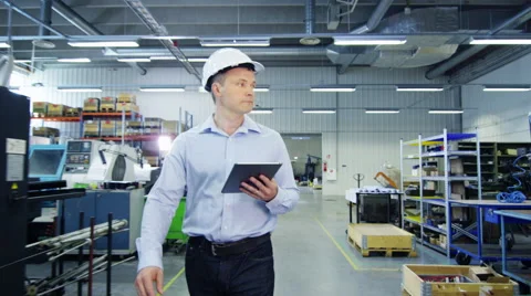 Engineer is Walking Through Factory Stock Footage 52273312