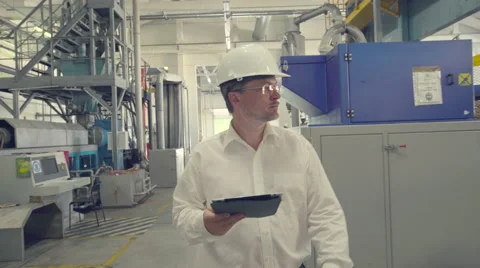 Engineer walking through factory Stock Footage 65422012