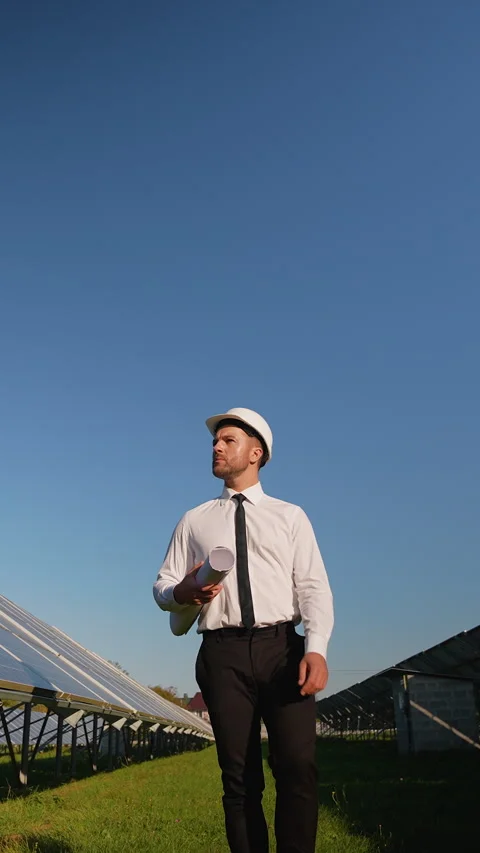 Engineer walking through solar station, inspecting installation Stock-Footage 296851362