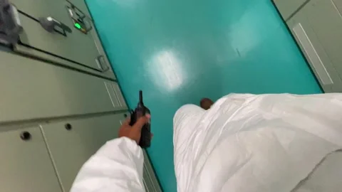 An engineer walks into an electrical room, POV View Stock Footage 164927128
