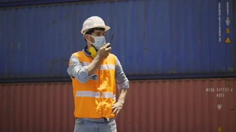 Engineer wearing a Hard hat And wear face mask while working in industrial plant Video stock 144861861