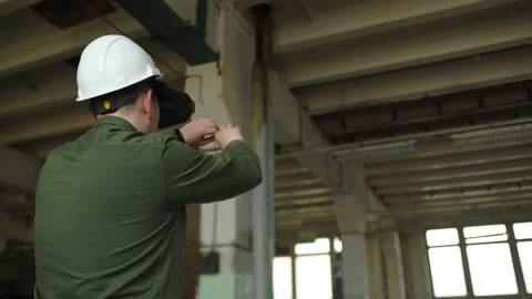 An engineer wearing virtual reality glasses moves digital objects with his hands Stock Footage 152754843
