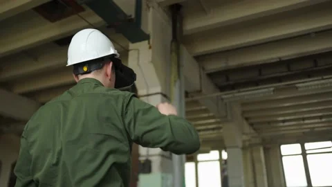 An engineer wearing virtual reality glasses moves digital objects with his hands Stock Footage 152755029