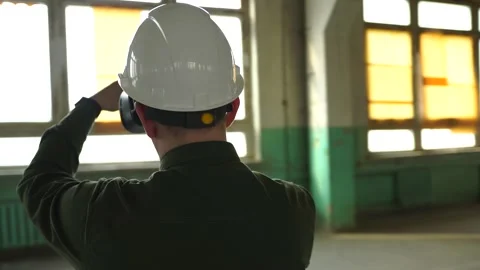An engineer wearing virtual reality glasses moves digital objects with his hands Stock Footage 152755454