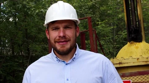 Engineer in a white helmet smiling Stock Footage 68431179