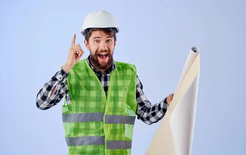 Engineer white helmets drawing project work professional Stock Photos