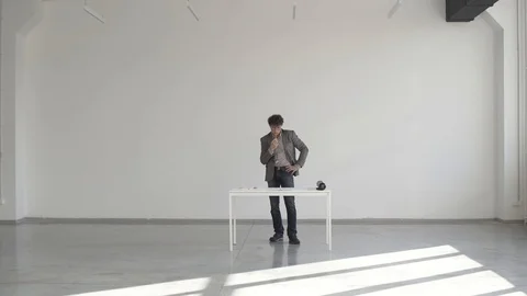 Engineer in a white room with a pencil draws a drawing or sketch Video stock 124941346