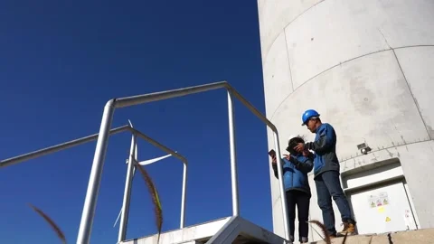 Engineer with wind turbine	 Stock Footage 165941333