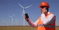 Engineer Wind Turbines Power Plant Tablet Supervise Mobile Phone Talk Teamwork 4k or 4k+ Resolution