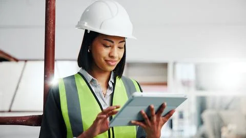 Engineer, woman and scroll at construction site with tablet, app or check Stock Photos