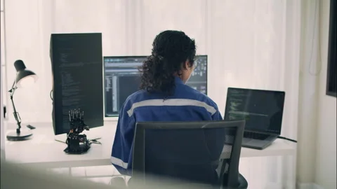 Engineer woman programming robotics system with laptop and computer. Stock Footage 319001597