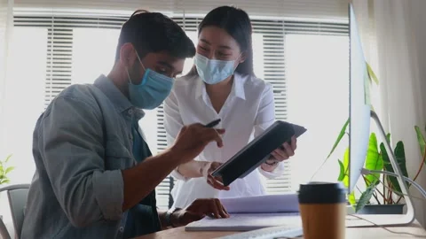Engineer work in office in front of computer, explain work to worker Stock Footage 146681126