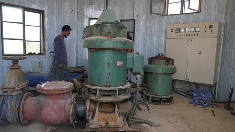 Engineer at work in pump house at Raqqah main water station, Syria Stock Footage 90078462