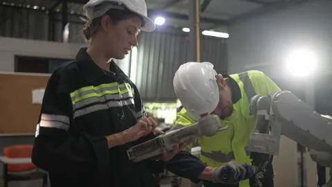 Engineer work at robotic arm factory. Stock Footage 239699489