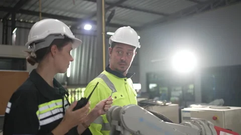 Engineer work at robotic arm factory. Stock Footage 239699756