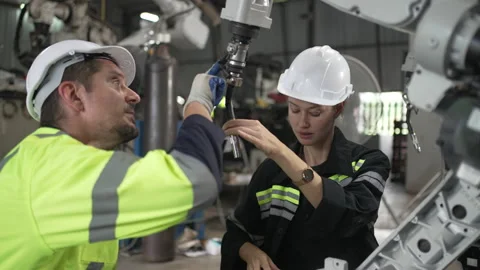 Engineer work at robotic arm factory. Stock Footage 239699771
