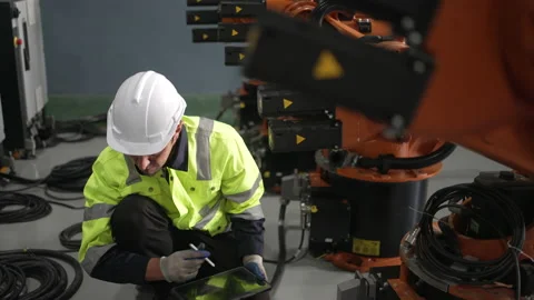 Engineer work at robotic arm factory. Stock Footage 239699974