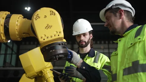 Engineer work at robotic arm factory. Stock Footage 241876357