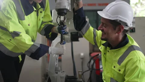 Engineer work at robotic arm factory. Stock Footage 241877410