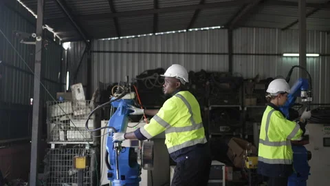 Engineer work at robotic arm factory. Stock Footage 244561273