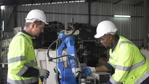 Engineer work at robotic arm factory. Stockbeeldmateriaal 244561291