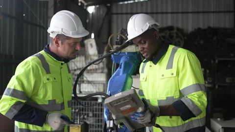 Engineer work at robotic arm factory. Stock Footage 244561563